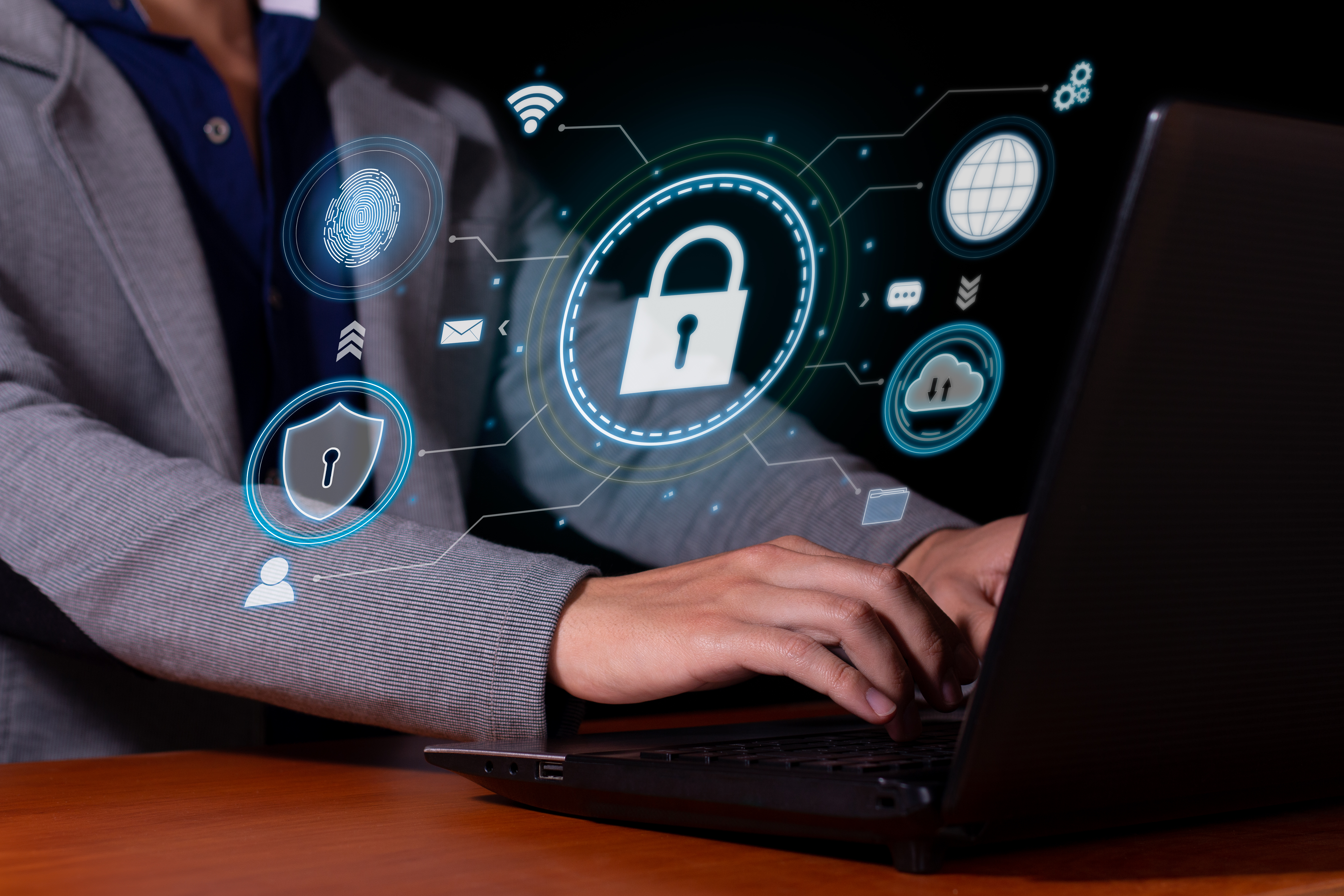 Hands-on network security training in a lab environment with multiple monitors displaying network diagrams and security tools.